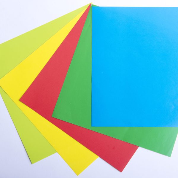 Stack of colored paper on white background